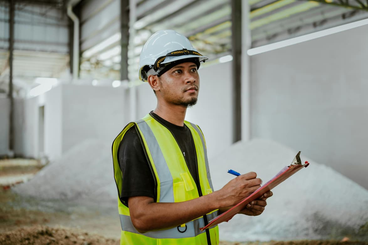 Field worker on a remote site, wearing the GPS button on a lanyard